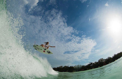 Caity Simmers surfing