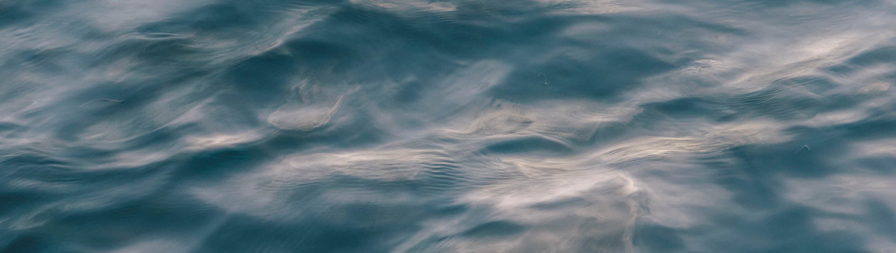 Close-up of blue water surface with ripples
