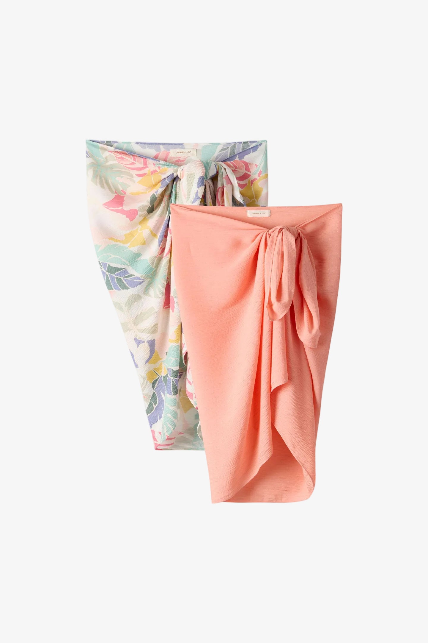 Two fabric wraps, one floral and one solid pink, on a white background