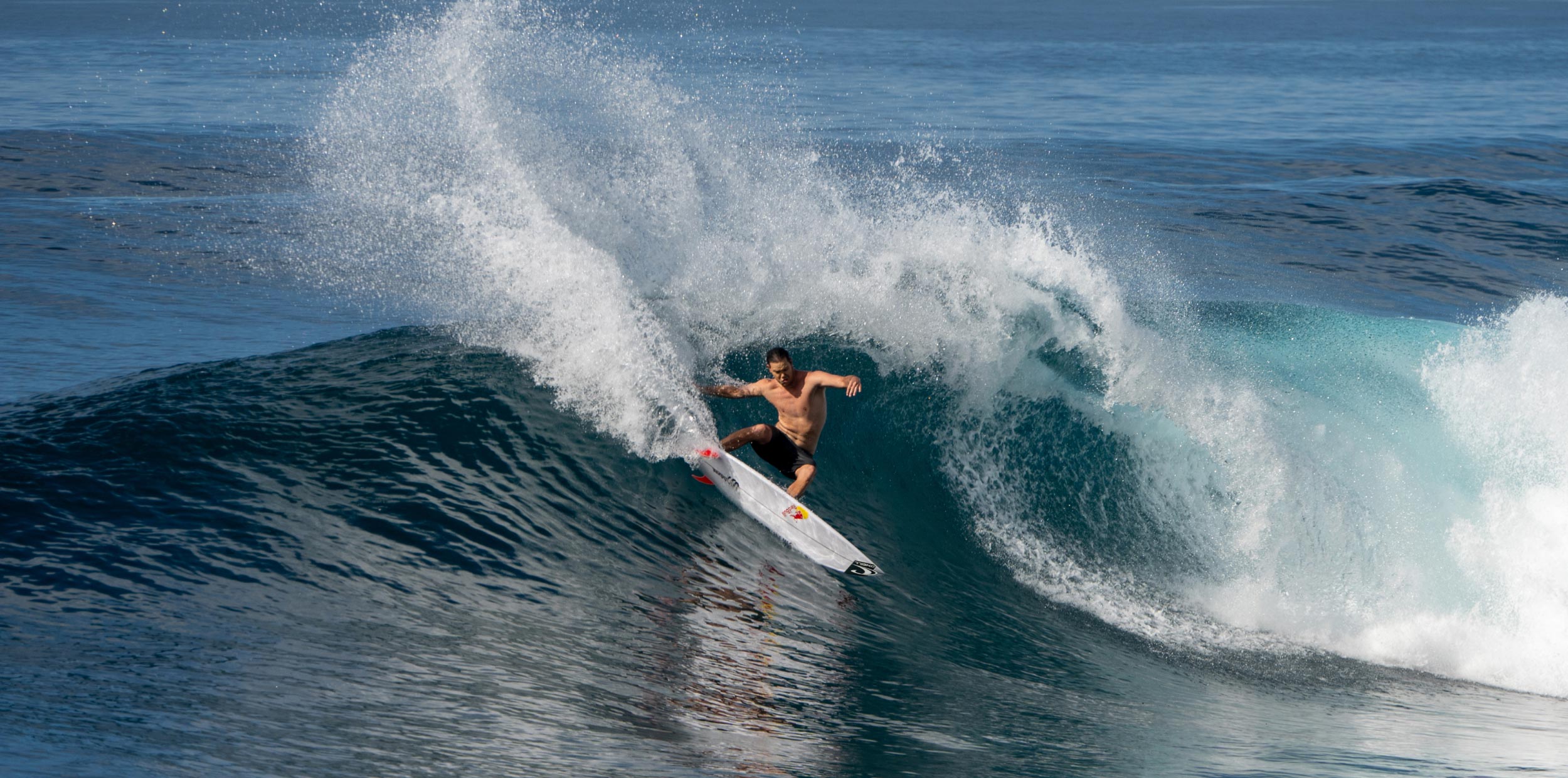 Surfer riding a wave in the ocean