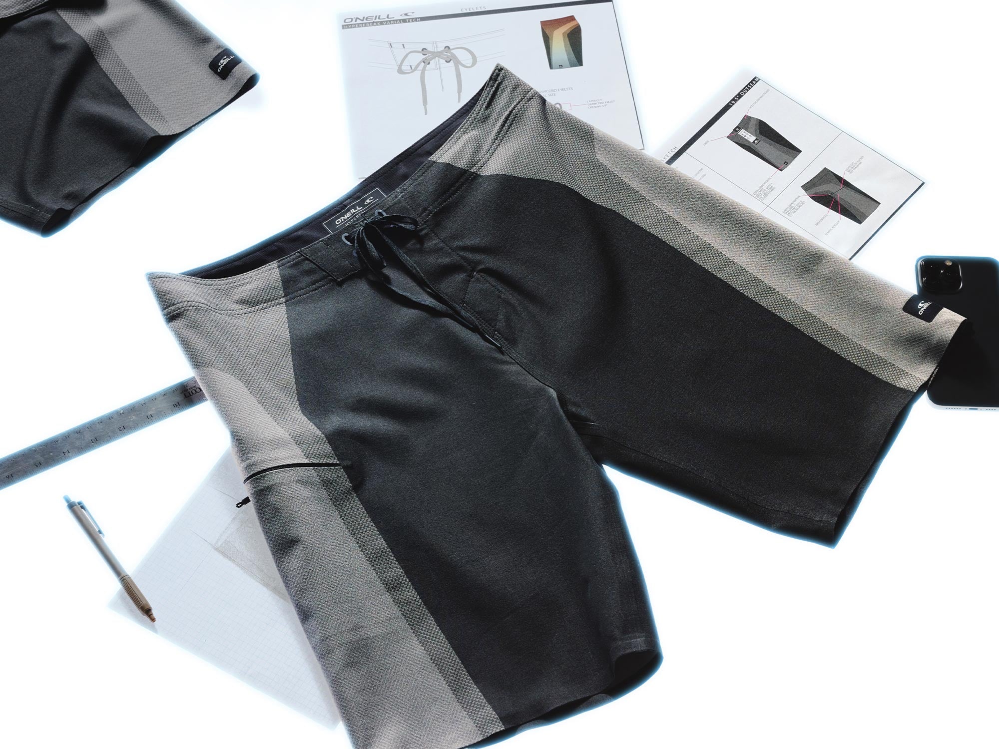 Black shorts with gray accents on a white background