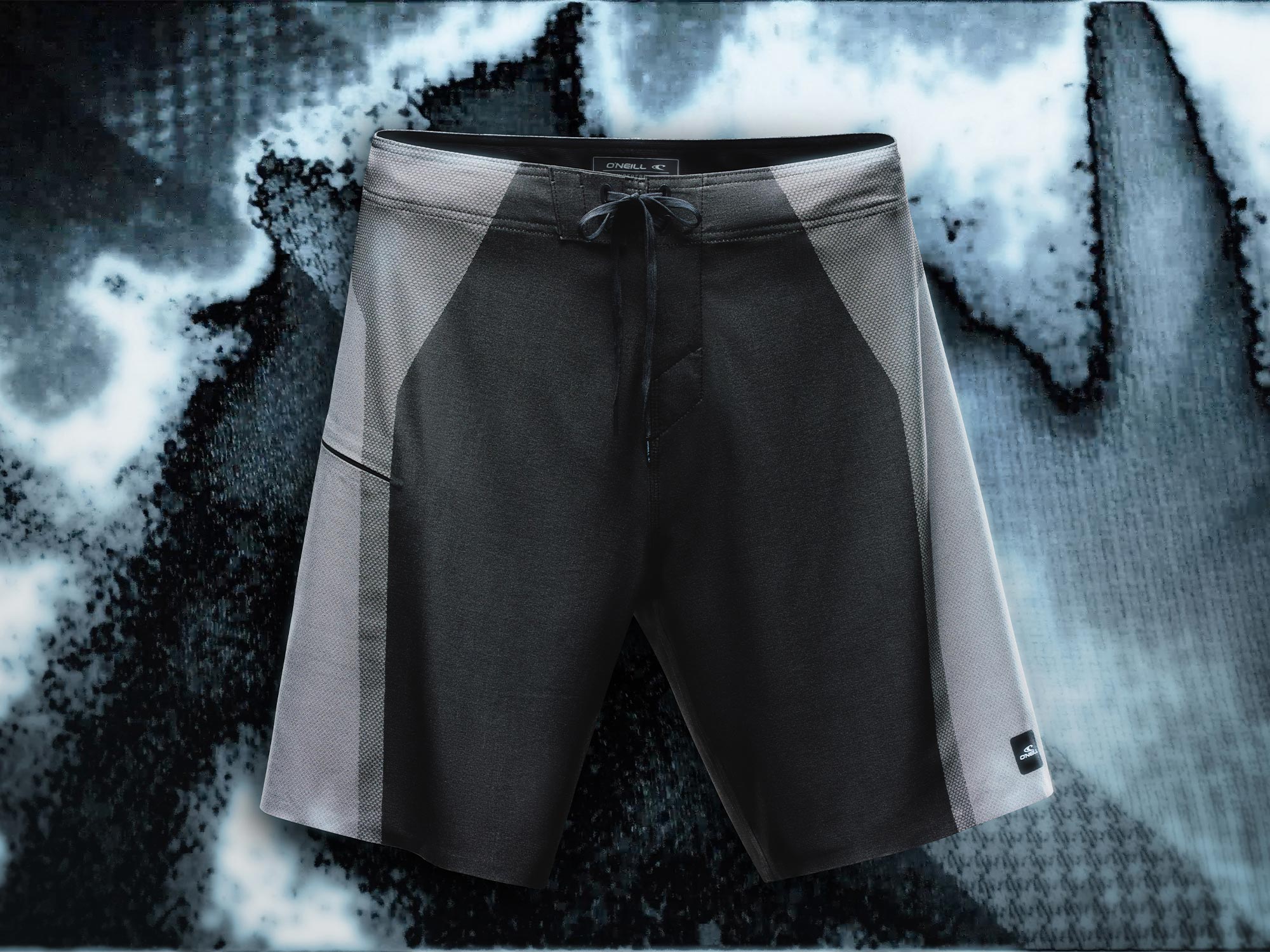 Black and gray shorts on a textured black and white background